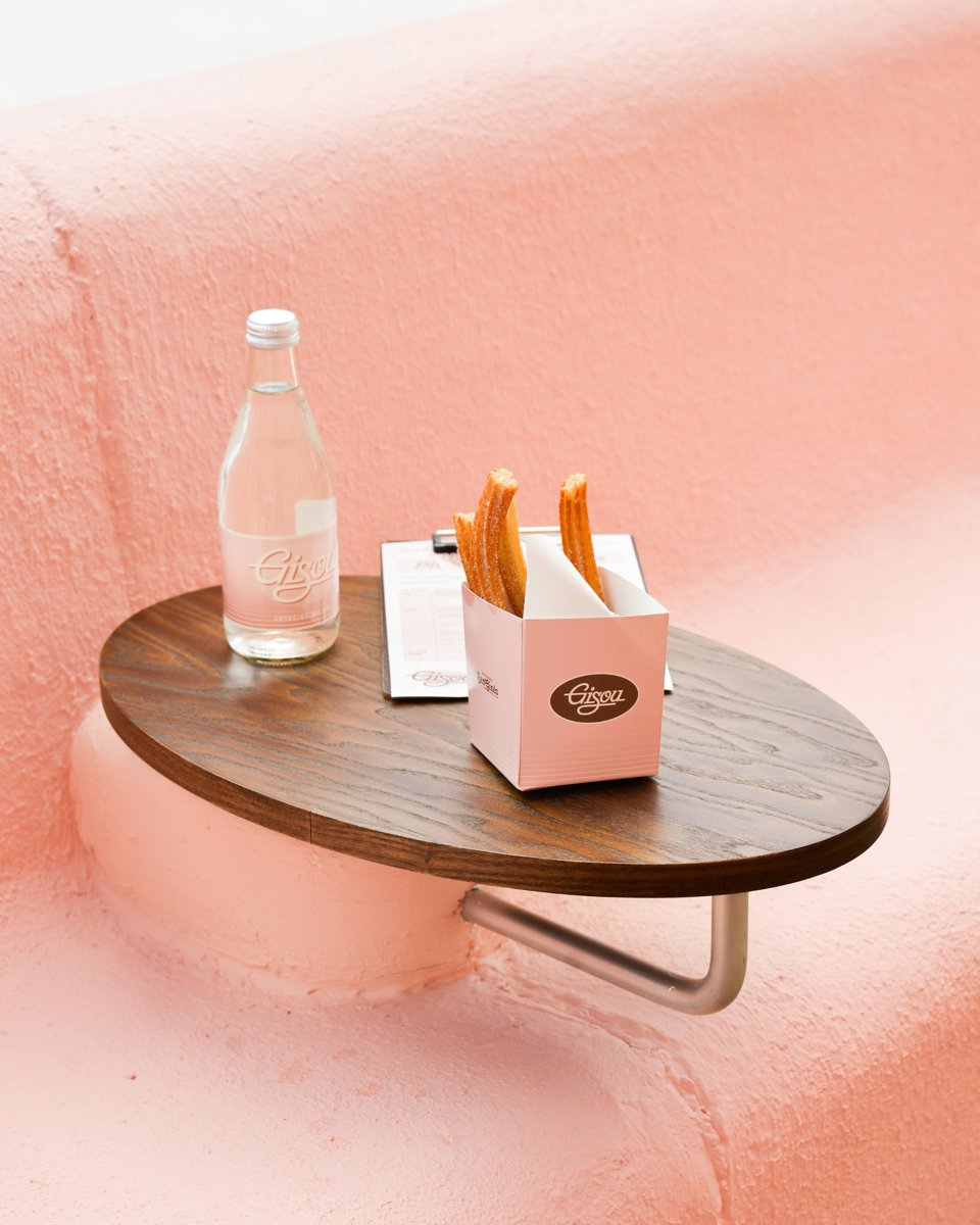 Churros and water on a wooden table